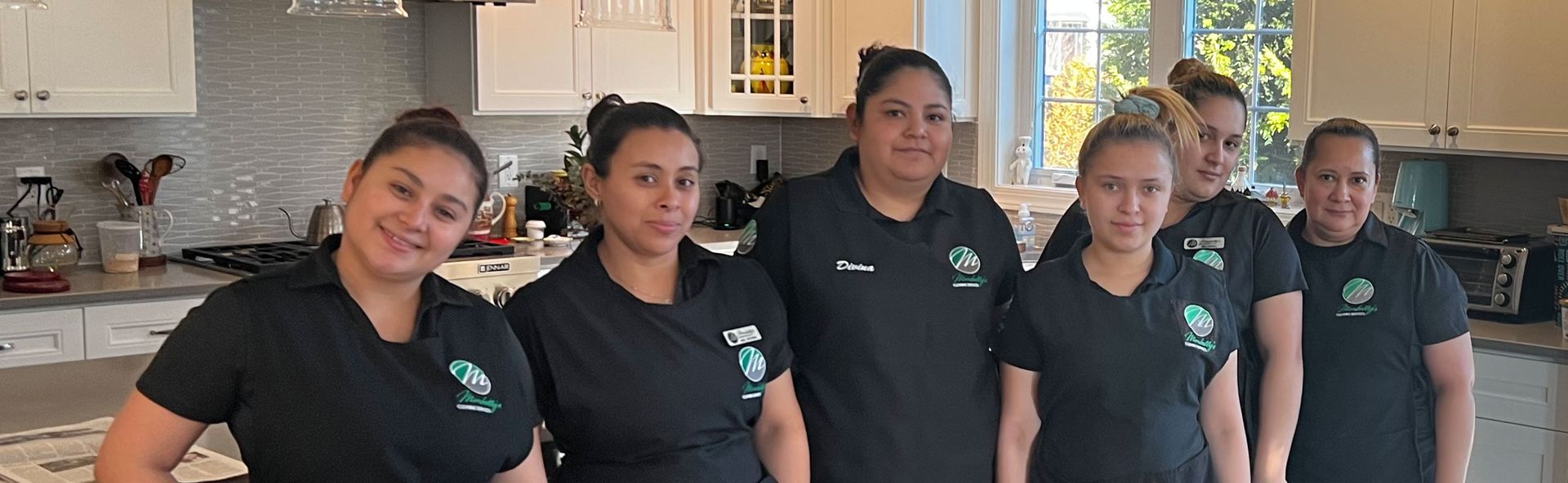 The Marbelly Cleaning Services team in a client's kitchen